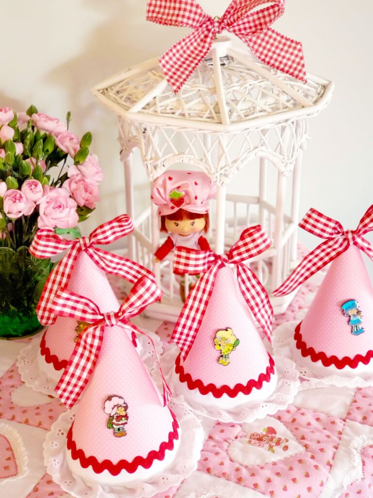 strawberry shortcake doll in a gazebo and party hats