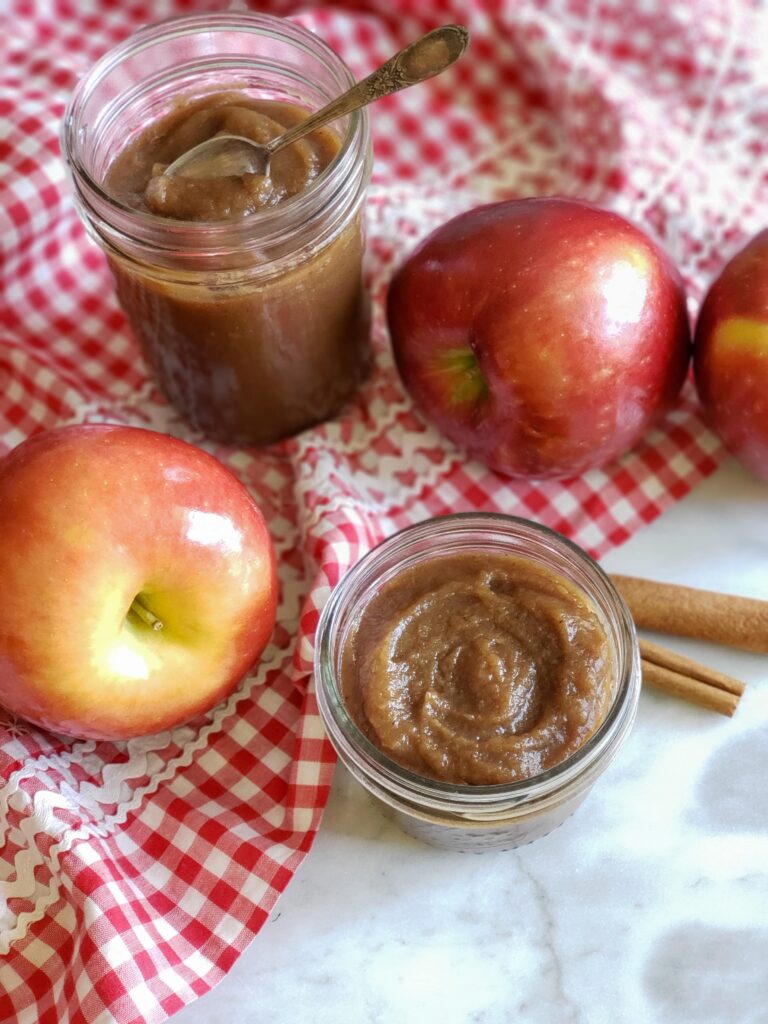 old fashioned apple butter in jars on gingham