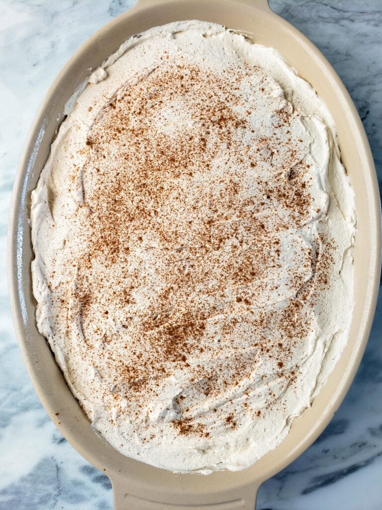 butterscotch pumpkin poke cake with cinnamon whipped cream