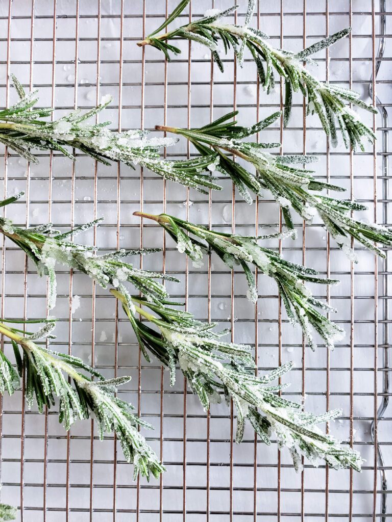 sugared rosemary on a wire rack