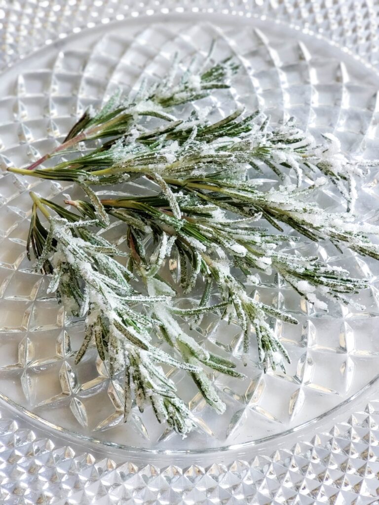 sugared rosemary on a glass tray