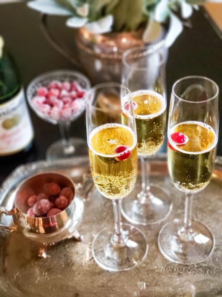 sugared cranberries in a drink