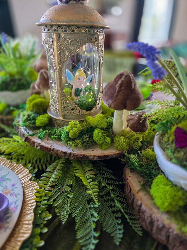 enchanted fairy party centerpiece with gold lantern and tinkerbell