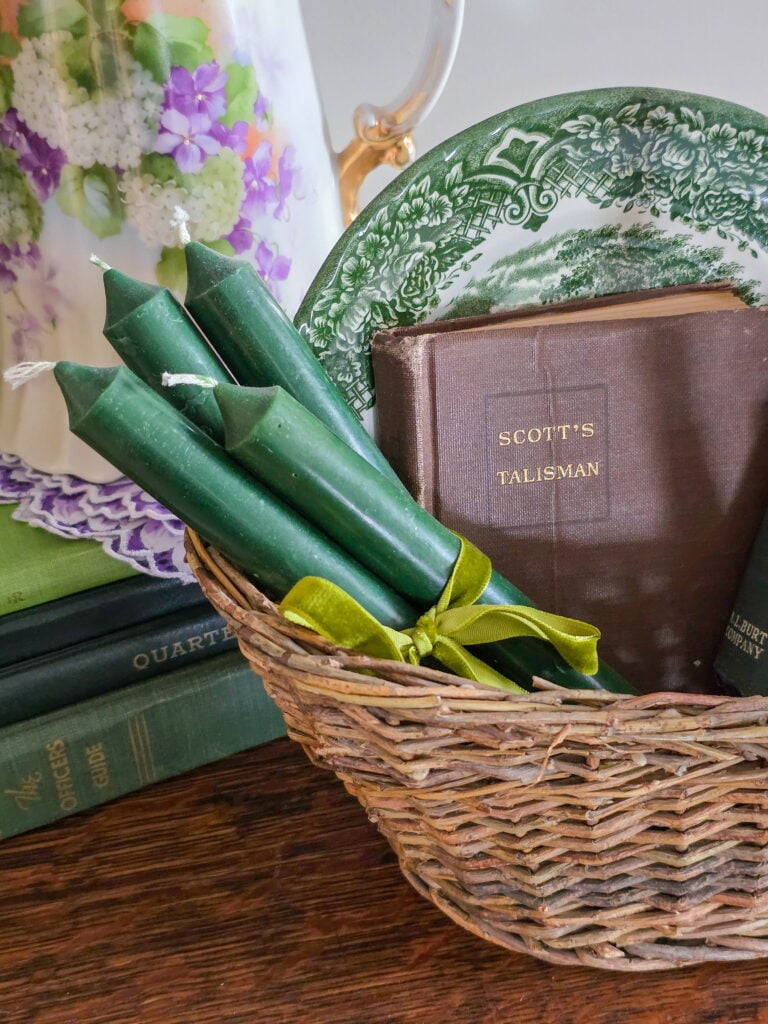 candles tied with ribbon in a basket