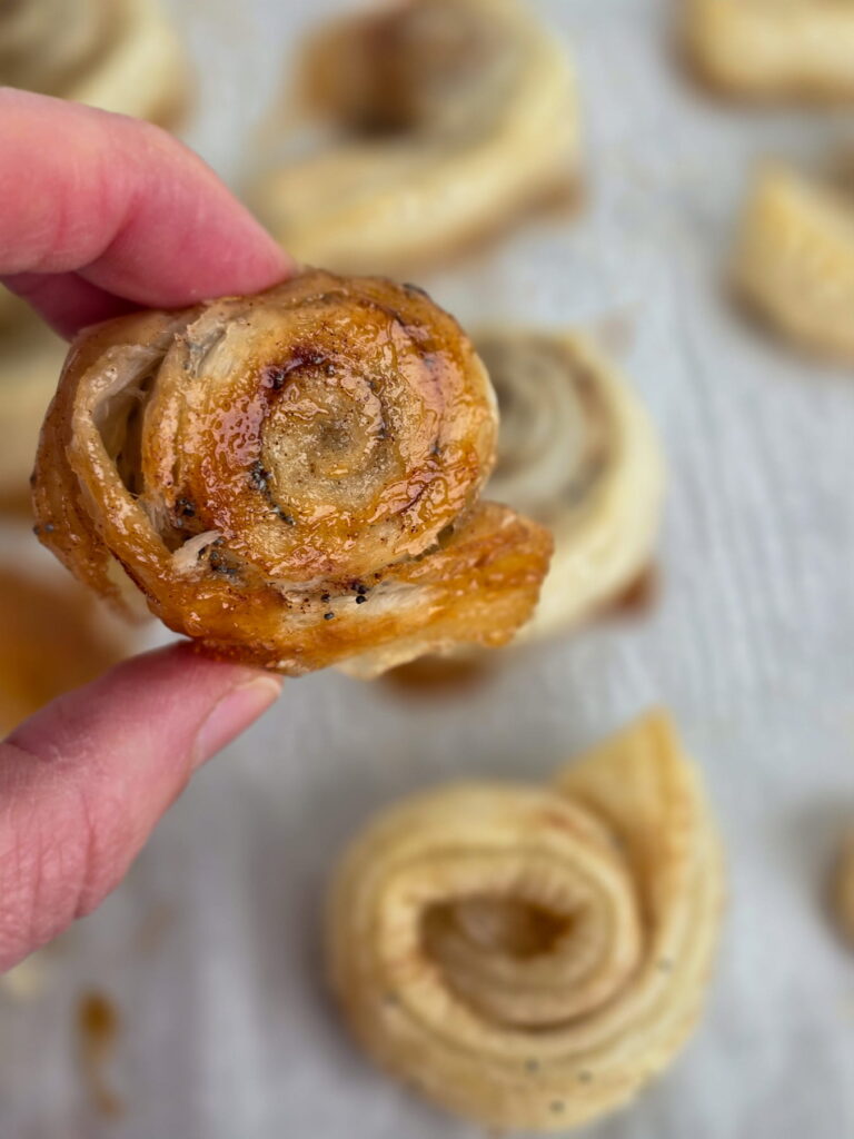 poppy puff rolls in a hand