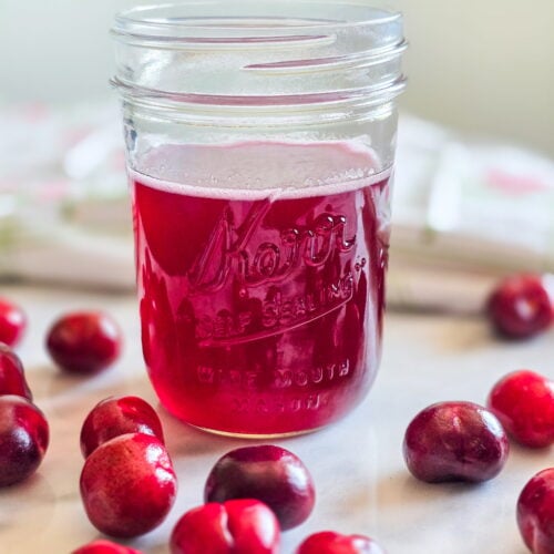 cherry simple syrup in a jar