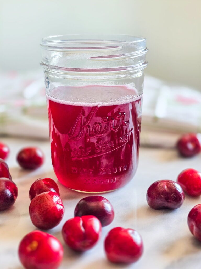 cherry simple syrup in a jar