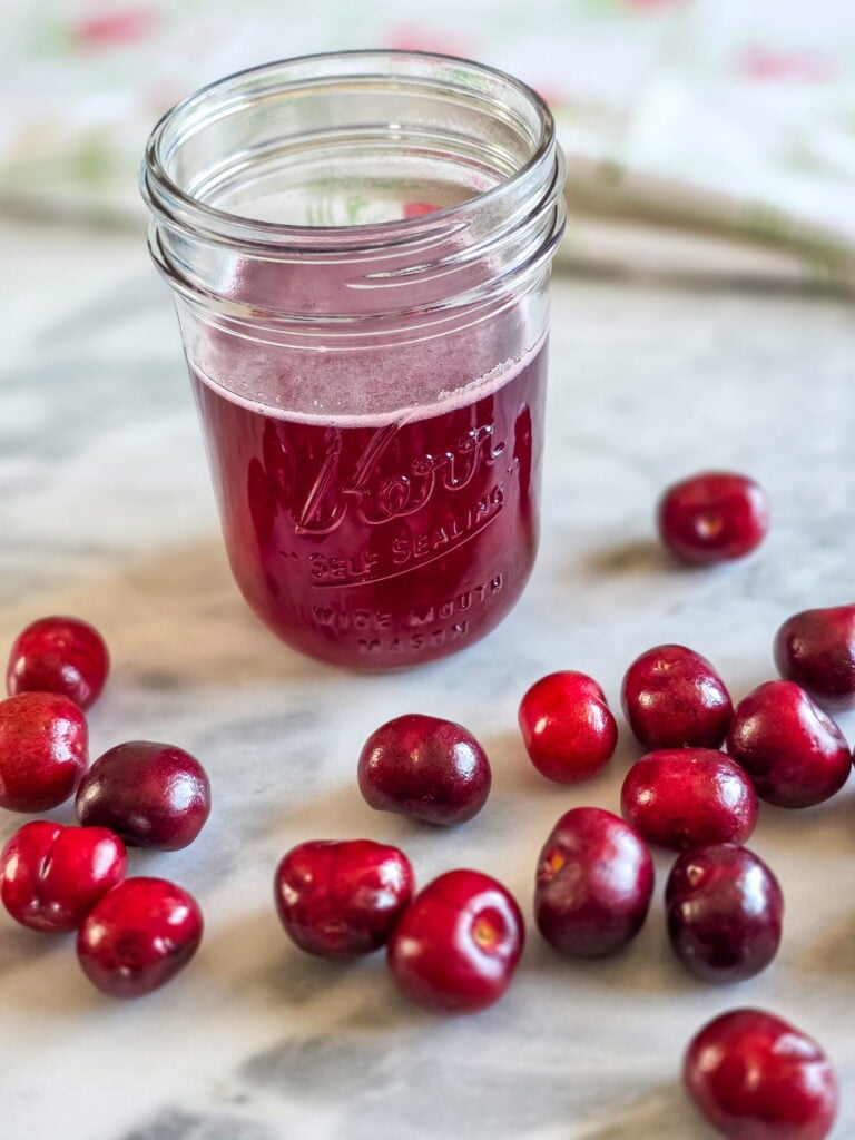 cherry simple syrup in a jar