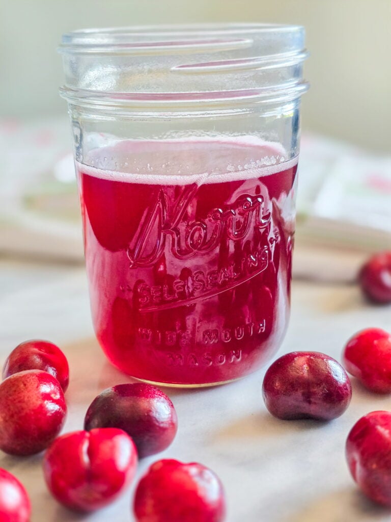 cherry simple syrup in a jar