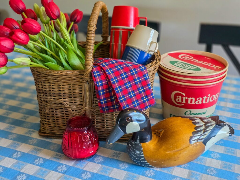 Vintage Cottage 4th of July Decor Ideas with Americana Charm featuring vintage crocks, baskets, gingham, and flowers