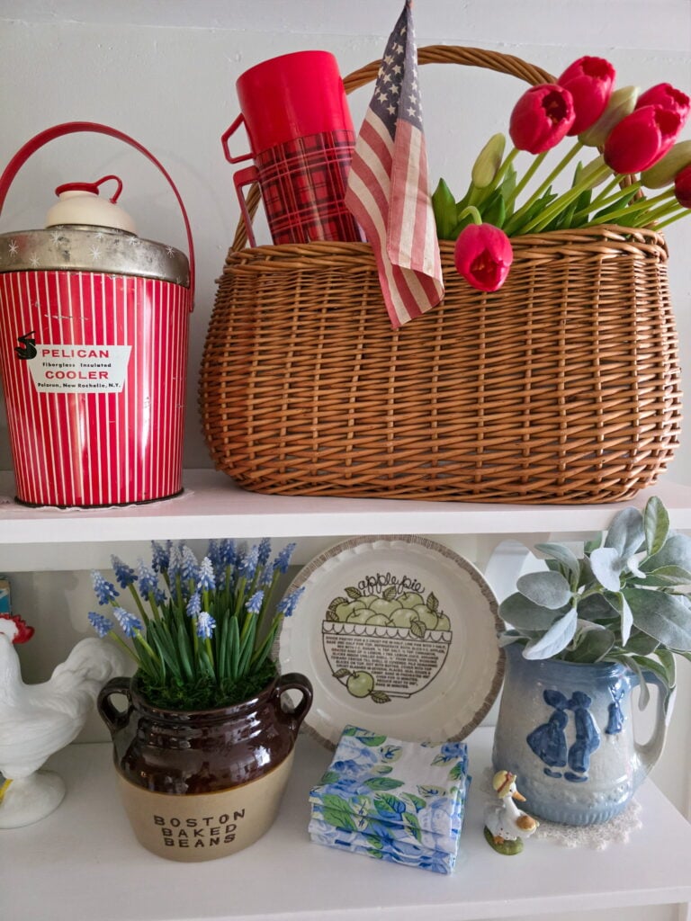 Vintage Cottage 4th of July Decor Ideas with Americana Charm featuring vintage crocks, baskets, gingham, and flowers