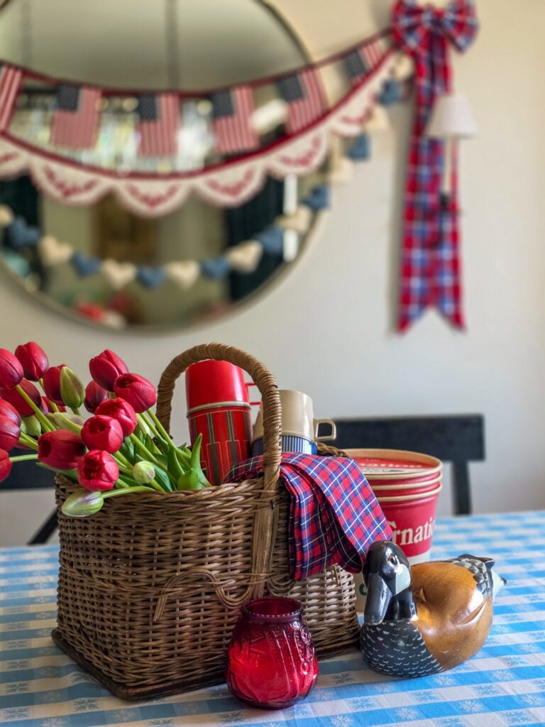 Vintage Cottage 4th of July Decor Ideas with Americana Charm featuring vintage crocks, baskets, gingham, and flowers