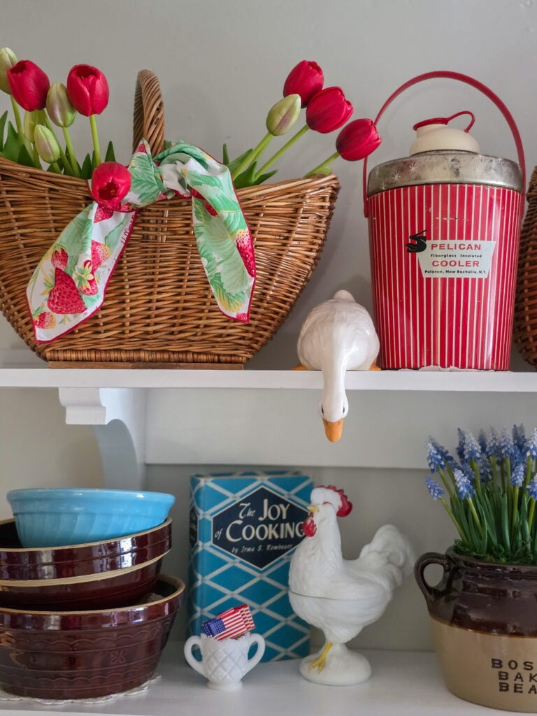 Vintage Cottage 4th of July Decor Ideas with Americana Charm featuring vintage crocks, baskets, gingham, and flowers