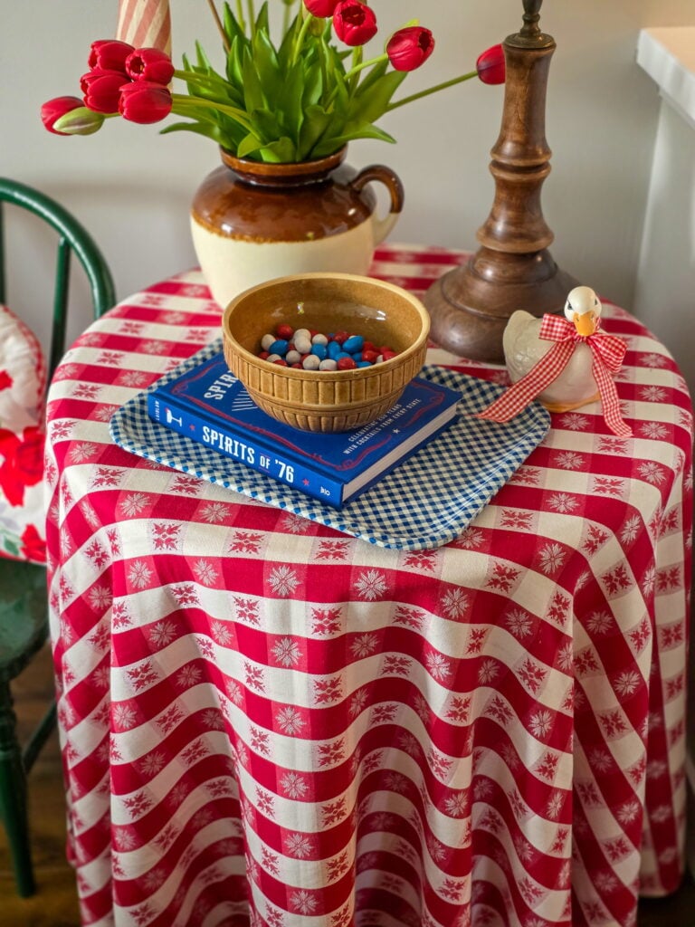Vintage Cottage 4th of July Decor Ideas with Americana Charm featuring vintage crocks, baskets, gingham, and flowers