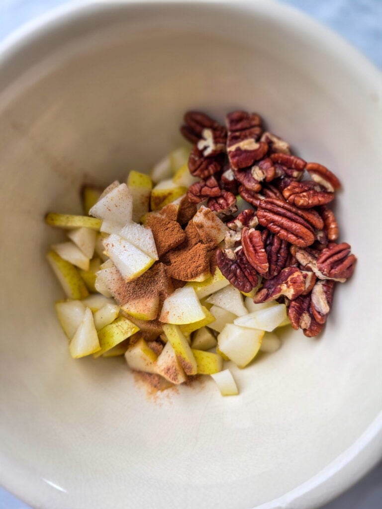 pear pecan baked brie ingredients in bowl