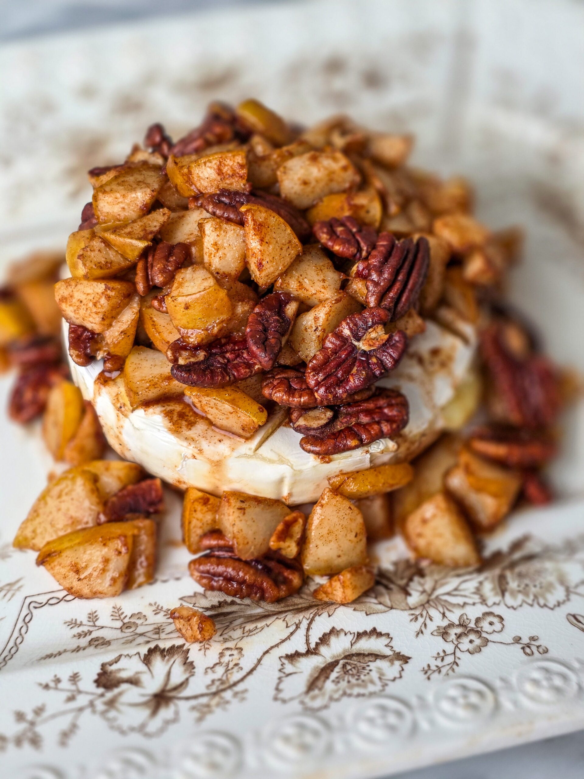 pear pecan baked brie on a vintage transferware platter